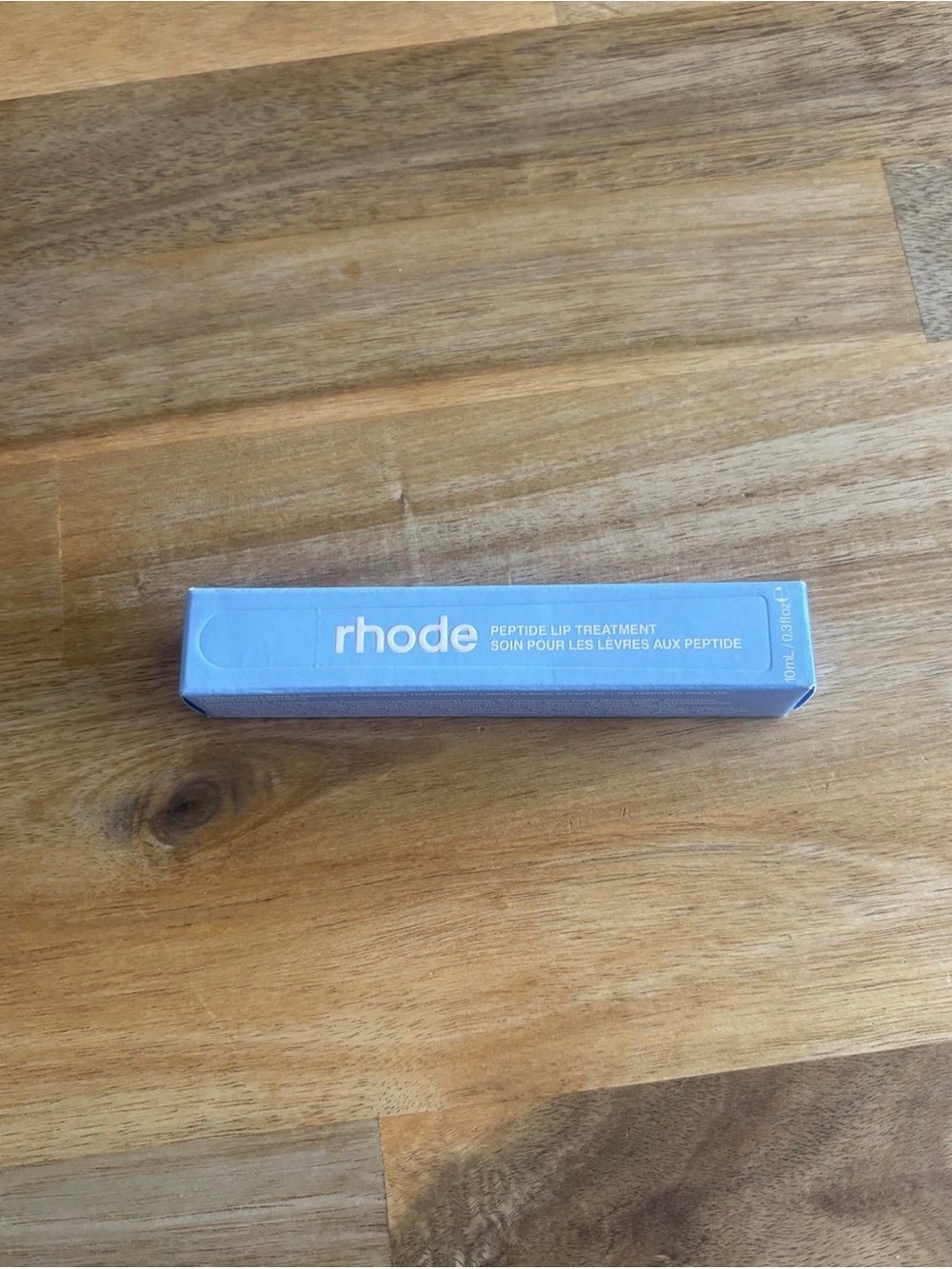 RHODE Peptide Lip Treatment in Light Blue Box